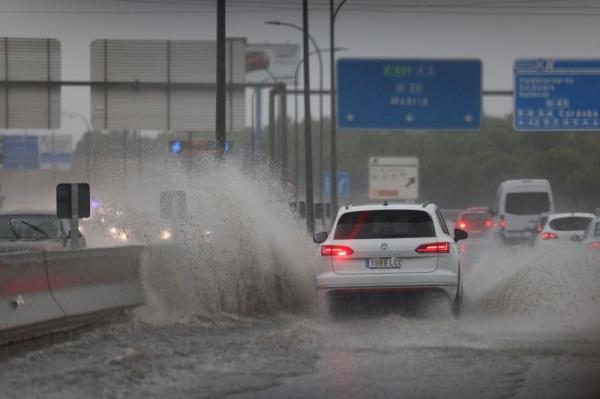 Madrid residents told to stay at home as torrential rain sweeps across Spain